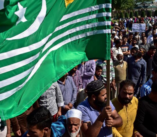 A Kashmir protester holds a flag during the rally.A rally|Nav 56