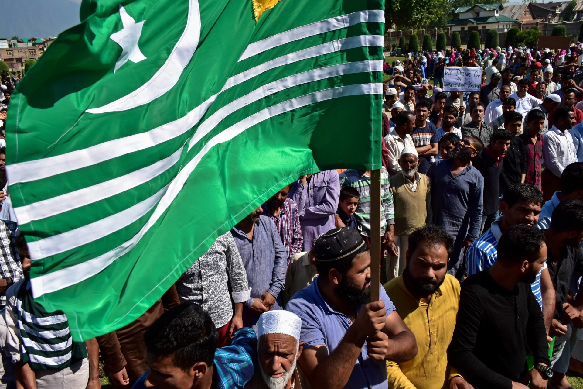 A Kashmir protester holds a flag during the rally.A rally|Nav 56