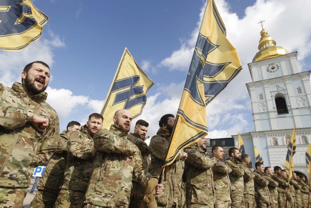 'Azov' far-right activists shout slogans during the march.