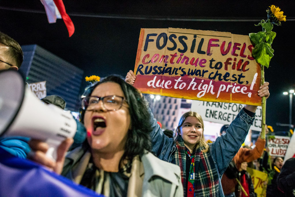 A protester holds a placard expressing her opinion during|20221110-Renewable-Energy-Euro-Gas-Pipeline|20221110-Renewable-Energy_Europe-Electricity|20221110-Renewable-Energy_Renewable-Energy-Days|20221110-Renewable-Energy-Euro-Green-Deal