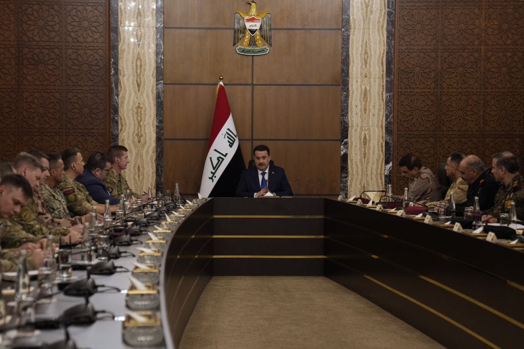 Iraqi Prime Minister Mohammed Shia al-Sudani (C) chairs the first session of talks on the future of American and other foreign troops in the country, in Baghdad, Iraq, on Jan. 27, 2024. U.S. Maj. Gen. Joel Vowell also attended the meeting.