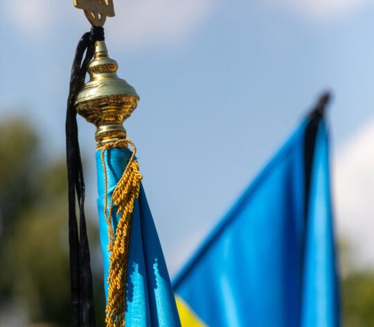 The Ukrainian flag seen prominently displayed with a black