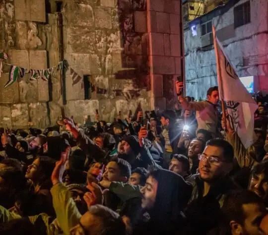 Crowds of people wait outside Umayyad Mosque in Damascus, as