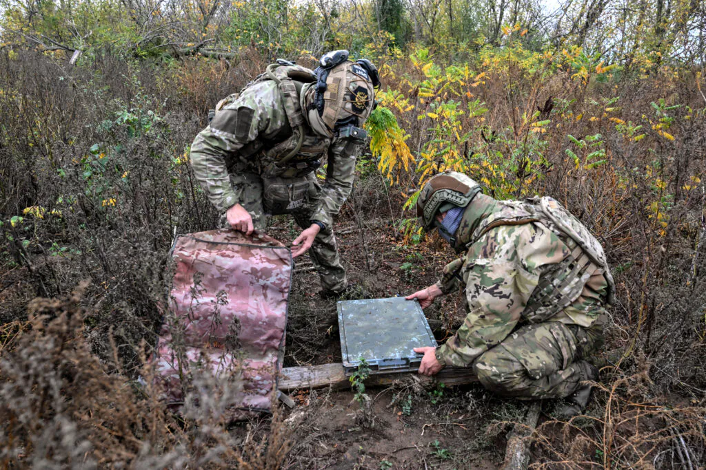 Ukrainian National Police officers set up Starlink terminal at positions in Donetsk region