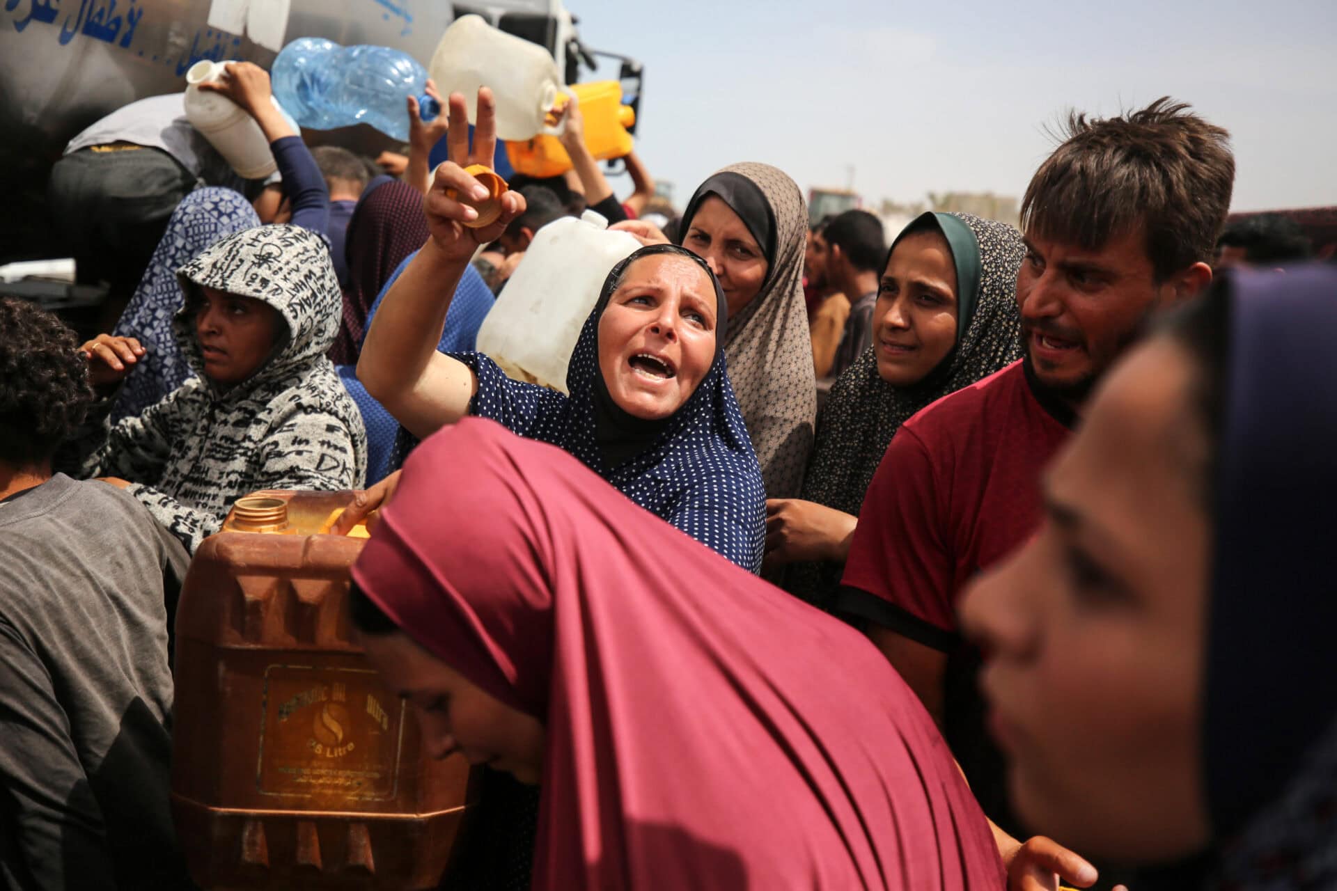 Palestinians Queue for Water in Gaza Amid Hamas-Israel Conflict